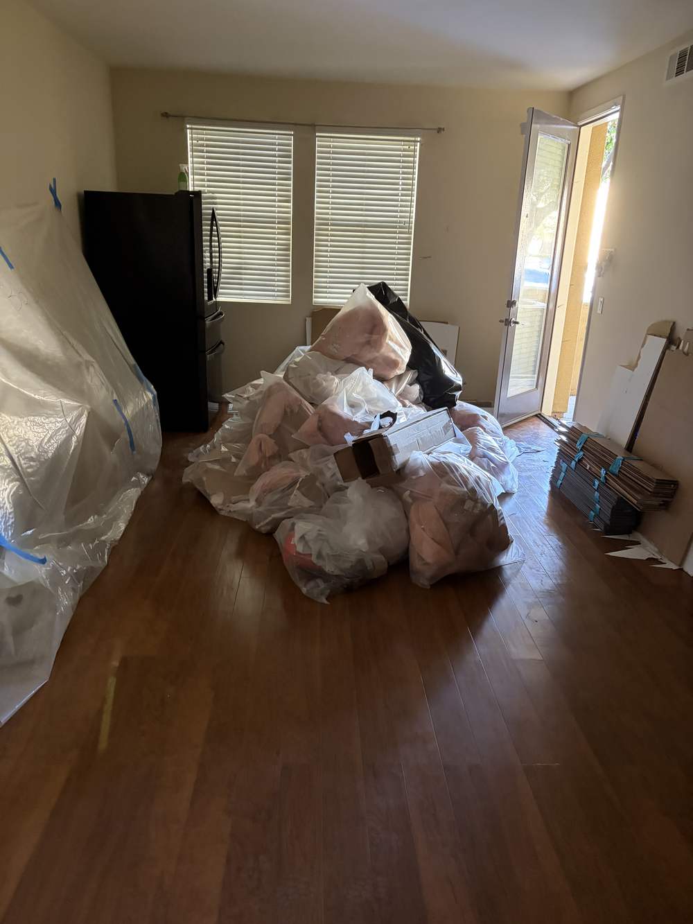 Bagged furniture and cushions staged for pickup in a Van Nuys home